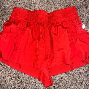 Red Free People movement get your flirt on shorts in size Large